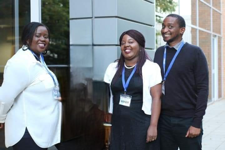 Three members of the Purified Hearts Care Services Ltd team smiling outside